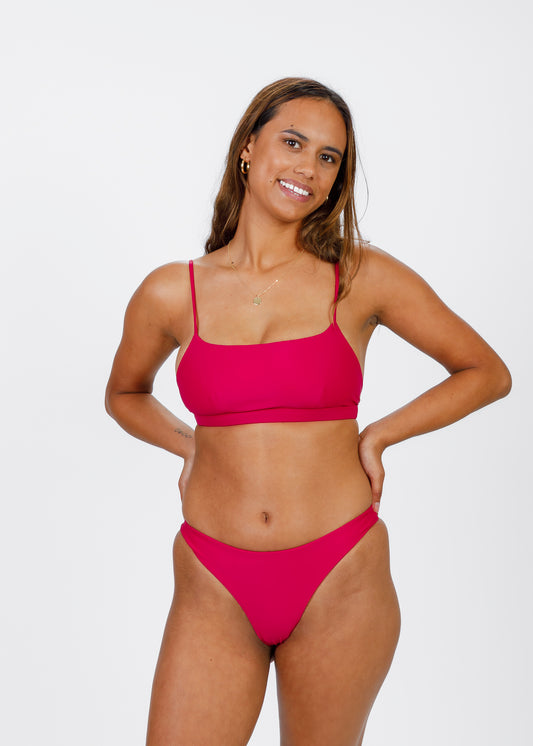 Front view of raspberry red classic-cut bikini bottoms from Tamara, featuring a sleek, smooth finish perfect for active beach days.